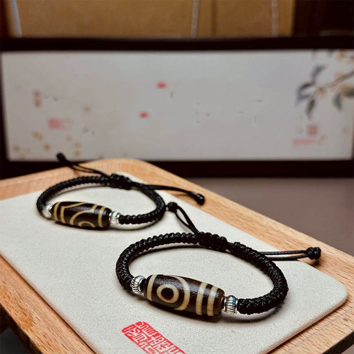 Buddha Stones Pulsera Tibetana con Cuentas Dzi de Nueve Ojos y de Tres Ojos para Protección y Riqueza