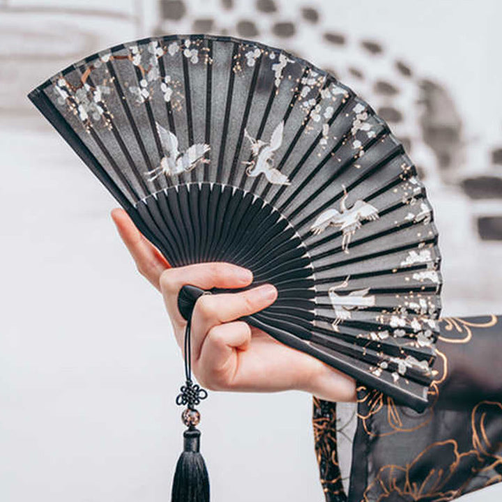 Abanico plegable de bambú de mano con grullas de flores de ciruelo y Buddha Stones