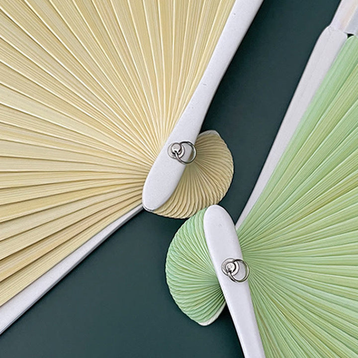 Abanico plegable de bambú con flores de begonia, orquídea y Buddha Stones