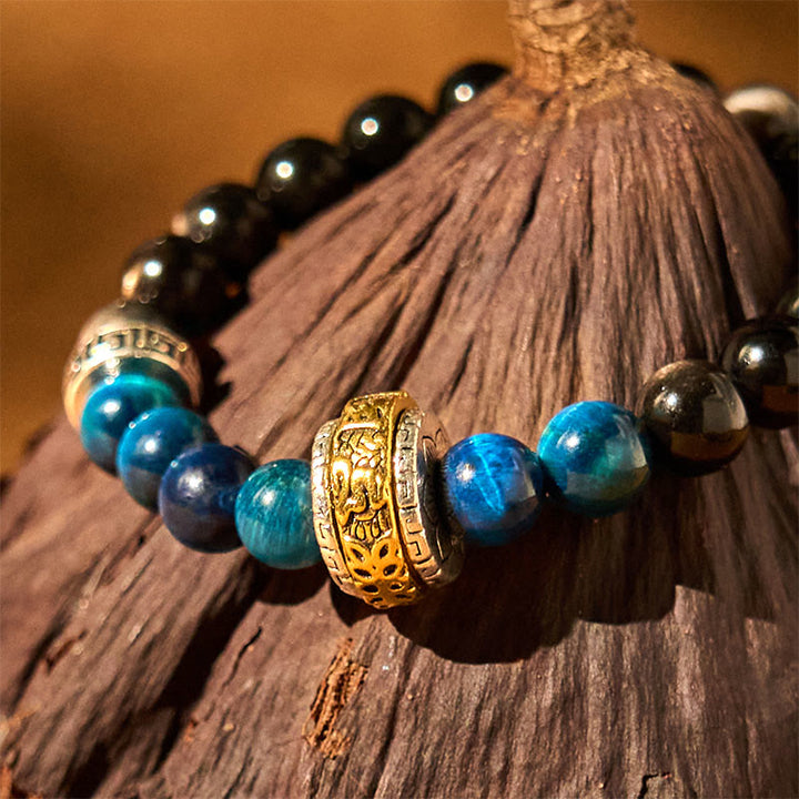 Pulsera protectora de obsidiana azul con ojo de tigre y Buddha Stones con brillo plateado