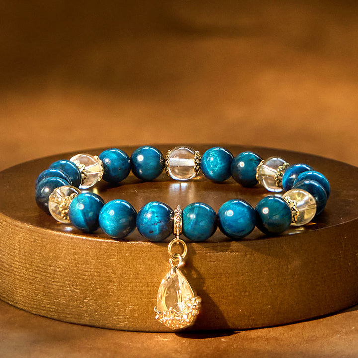 Pulsera de fuerza con gotas de agua de cristal blanco y ojo de tigre azul de Buddha Stones