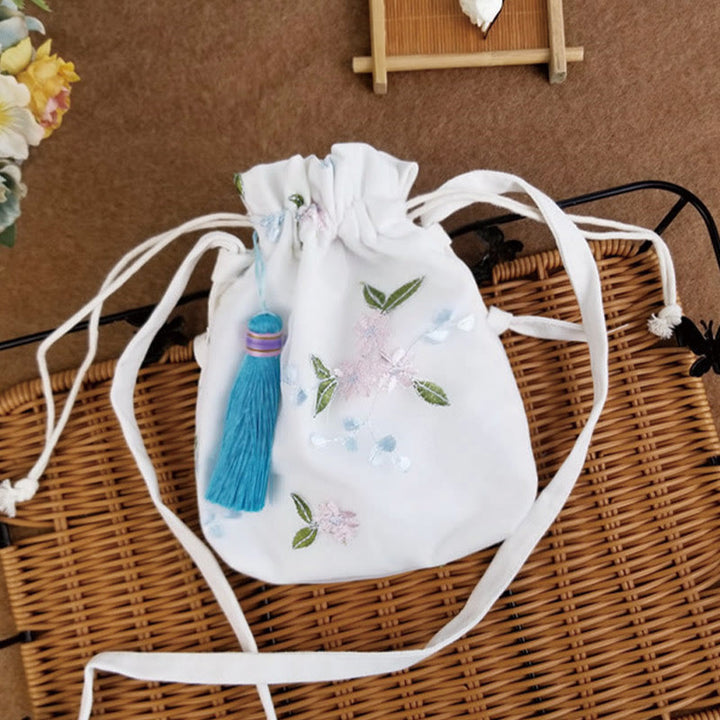 Bolso bandolera de lona con Buddha Stones , flores bordadas y flores de cerezo enredaderas.