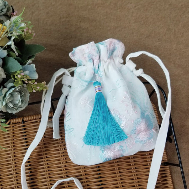 Bolso bandolera de lona con Buddha Stones , flores bordadas y flores de cerezo enredaderas.