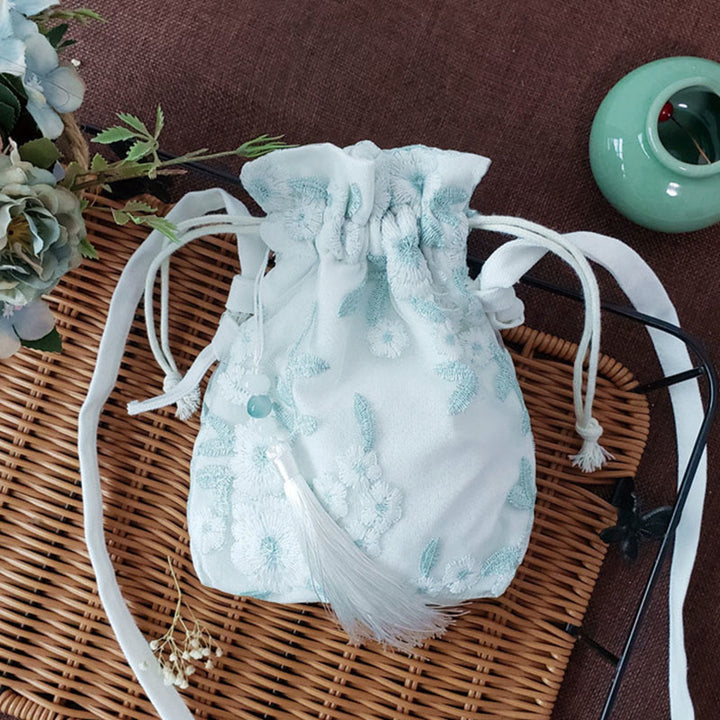 Bolso bandolera de lona con Buddha Stones , flores bordadas y flores de cerezo enredaderas.