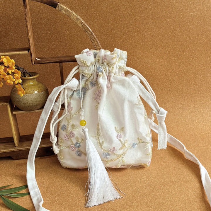 Bolso bandolera de lona con Buddha Stones , flores bordadas y flores de cerezo enredaderas.