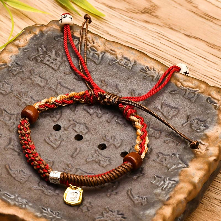 Pulsera trenzada de madera con protección de la diosa de la riqueza tibetana Zakiram hecha a mano con Buddha Stones
