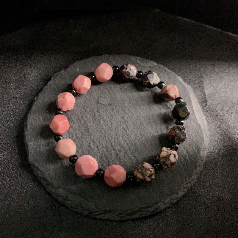Pulsera curativa con cuentas poligonales de Buddha Stones, rodonita natural, línea negra y punto rojo