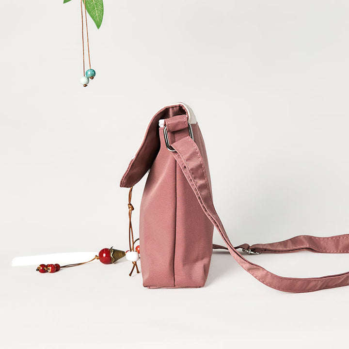 Bolso bandolera de lino y algodón con bordado de Buddha Stones , color marrón liso y ciruela.