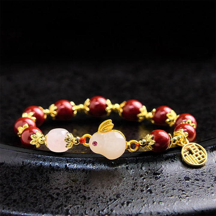 Pulsera con dije de bendición de Buddha Stones de cinabrio y un lindo conejo Fu