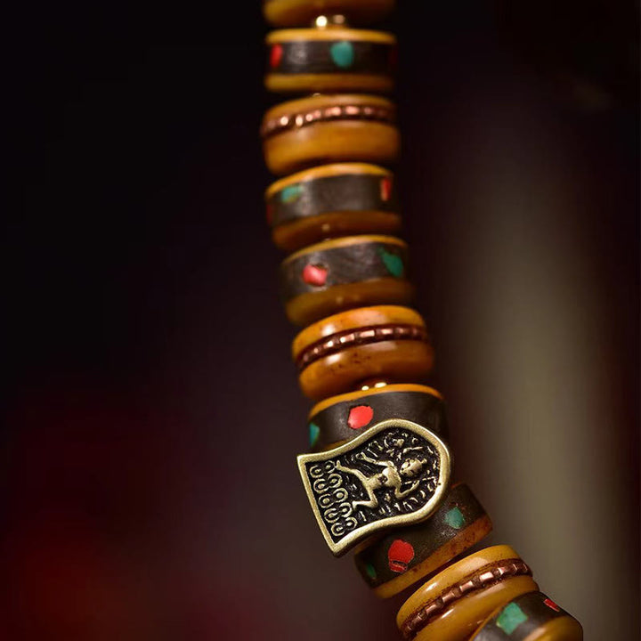 Pulsera de protección con borlas de hueso de camello tibetano y Buddha Stones