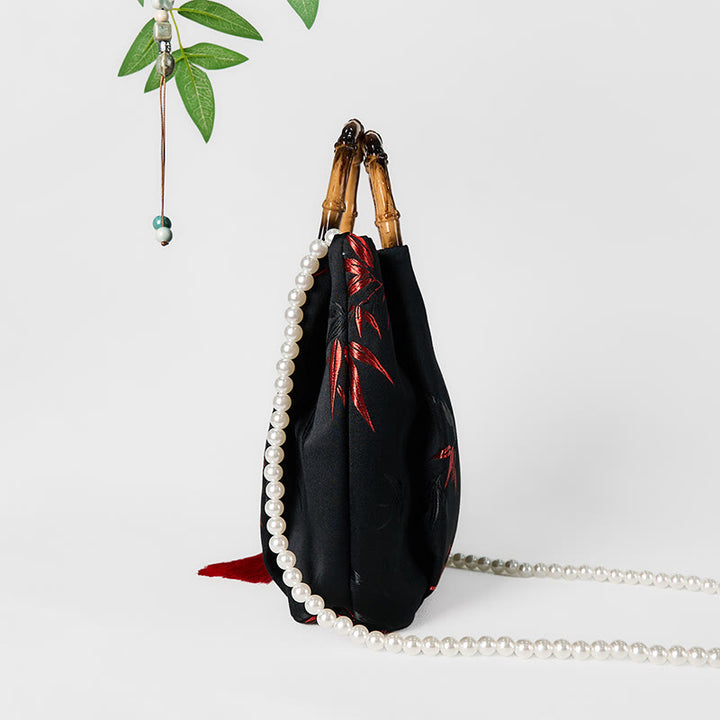 Bolso bandolera con Buddha Stones y asa de bambú y perlas.