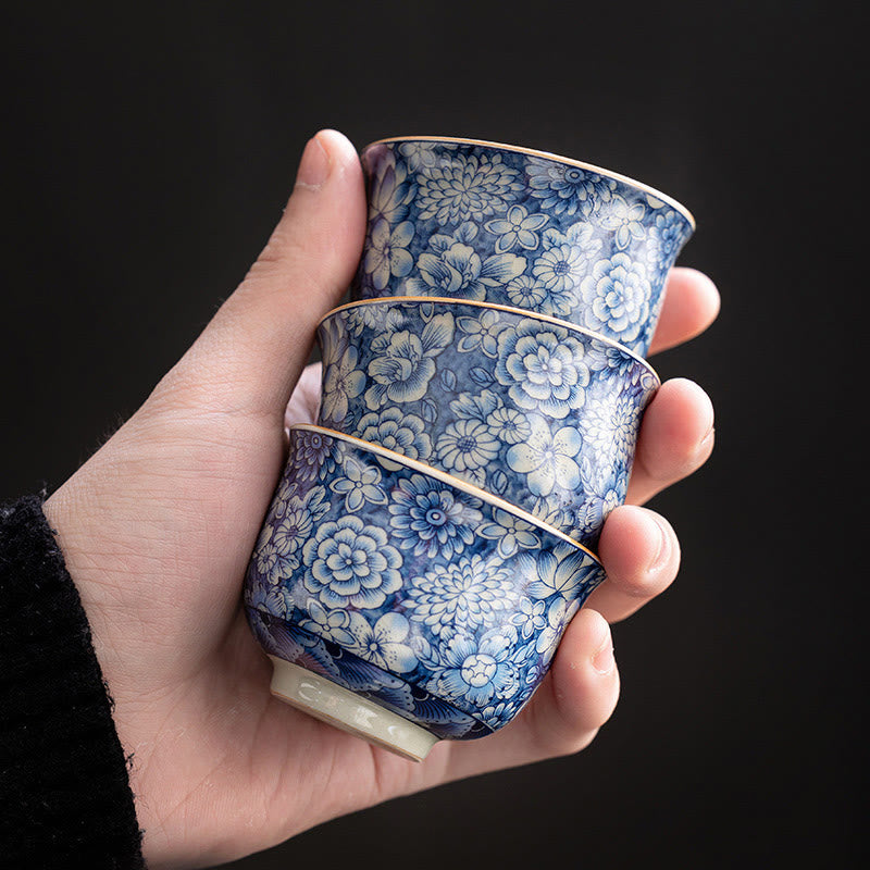 Tazas de té de cerámica de crisantemo con flor de ciruelo y peonía de loto Vintage con Buddha Stones