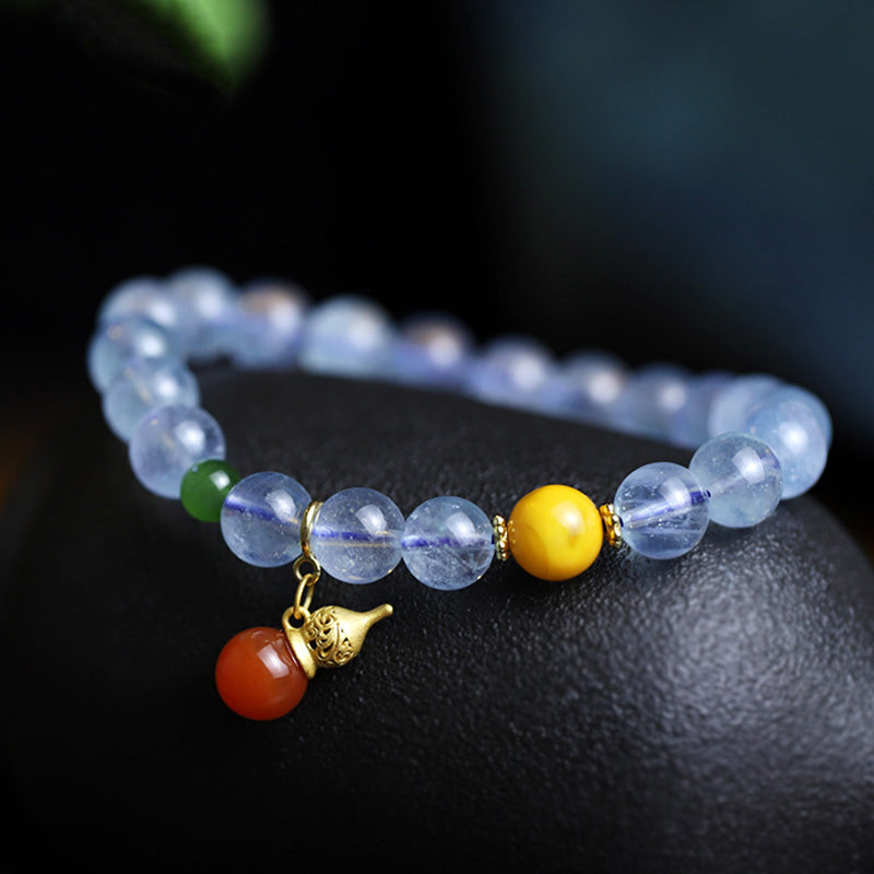 Pulsera con dije de calabaza de la paz con ágata roja y aguamarina