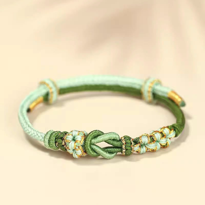 Pulsera de protección de la suerte con nudo de paz de ocho hilos con nudo de flor de melocotón hecho a mano con Buddha Stones