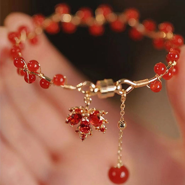 Pulsera con amuleto de la suerte de hoja de arce roja con Buddha Stones
