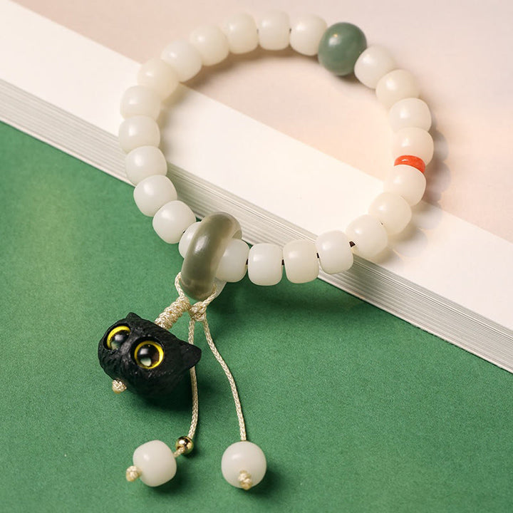 Pulsera de armonía de paz con dije de gato encantador de madera negra africana con semillas de Bodhi naturales de Buddha Stones - image 2
