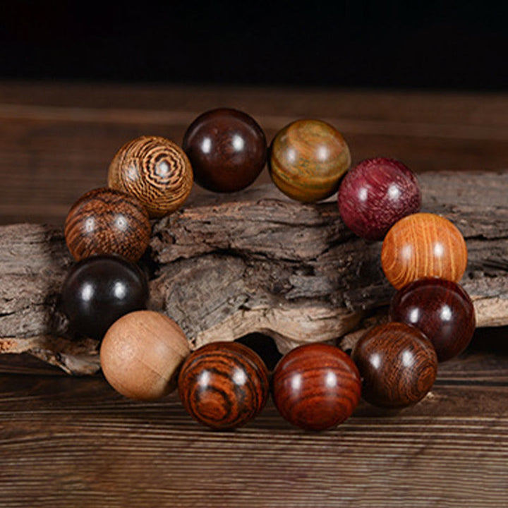 Pulsera curativa de protección de sándalo multicolor con Buddha Stones