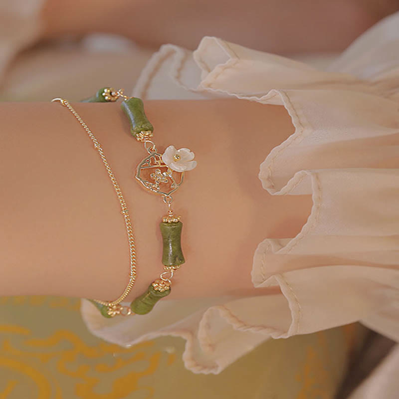 Pulsera de doble capa de cobre chapado en oro de 14 quilates con Buddha Stones , peridoto, flor de bambú y riqueza