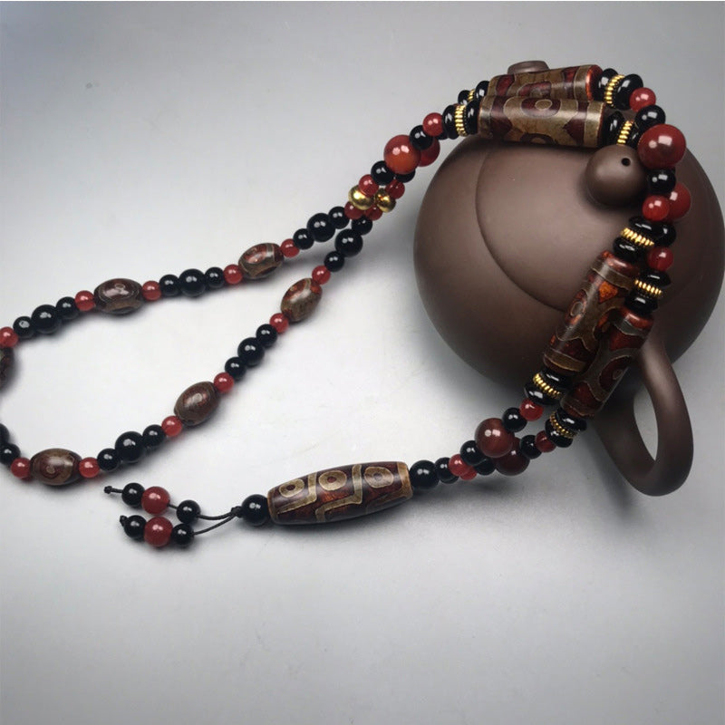 Collar de salud y riqueza con Buddha Stones Dzi de nueve ojos, ágata roja