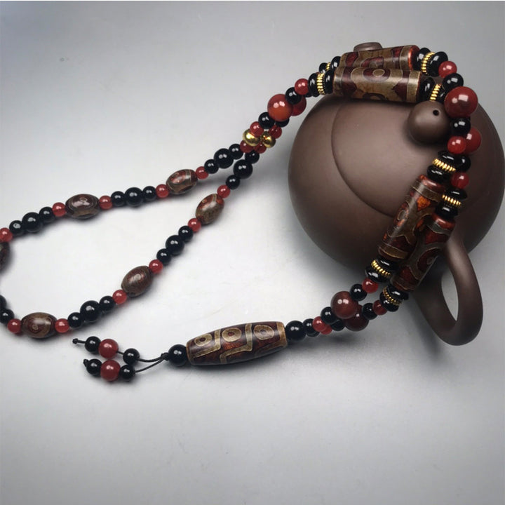 Collar de salud y riqueza con Buddha Stones Dzi de nueve ojos, ágata roja