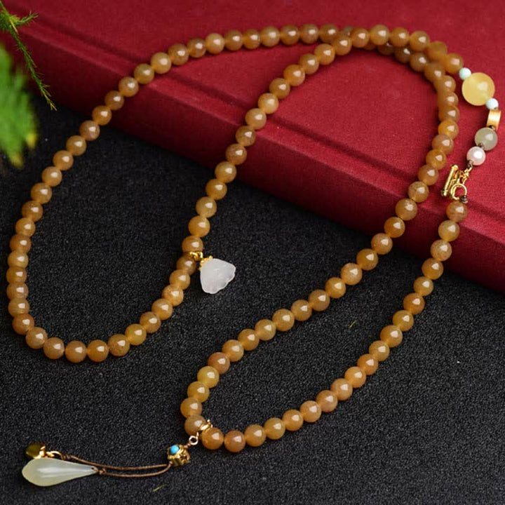 Pulsera de éxito de perlas de jade blanco de loto ámbar de topacio hetiano natural