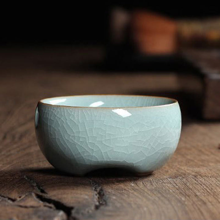 Taza de té de cerámica con forma de pez koi de colores y Buddha Stones