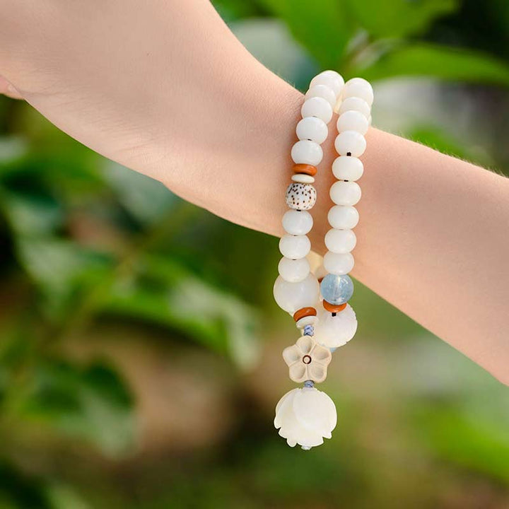 Pulsera de bendición de loto Bodhi de jade blanco tibetano con Buddha Stones