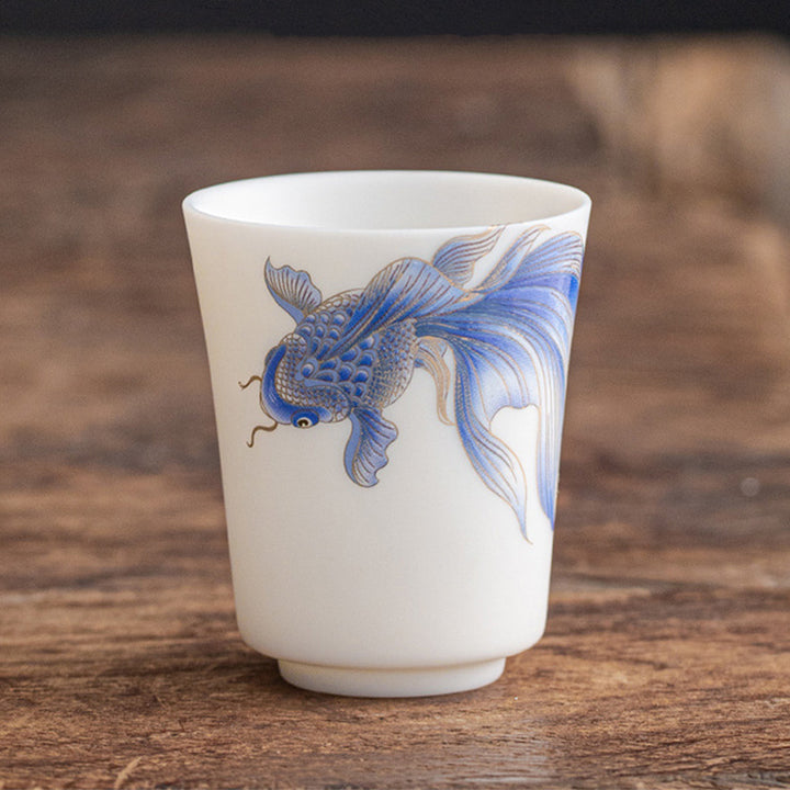 Taza de té de cerámica de porcelana blanca, pez Koi, Buddha Stones, taza de té de Kung Fu