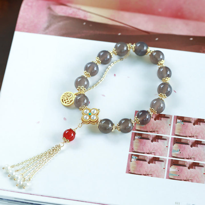 Pulsera de equilibrio con borlas y perlas de carácter Fu de ágata gris natural con Buddha Stones