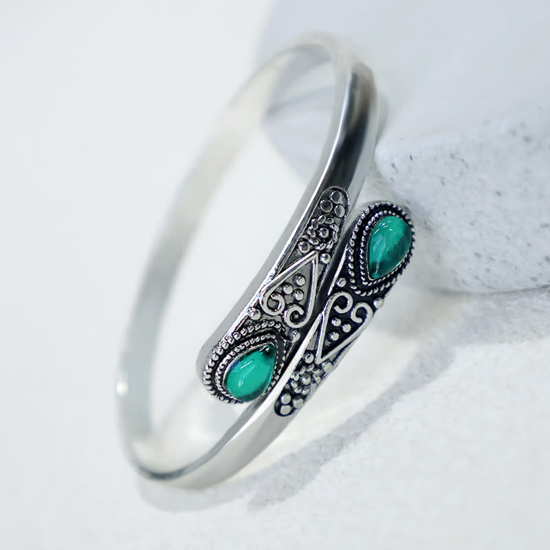 Brazalete de pulsera curativo con patrón de gota de agua de circonita con Buddha Stones
