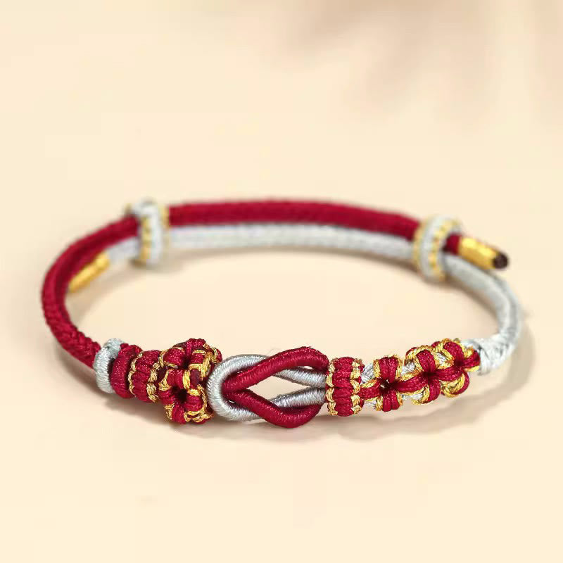 Pulsera de protección de la suerte con nudo de paz de ocho hilos con nudo de flor de melocotón hecho a mano con Buddha Stones