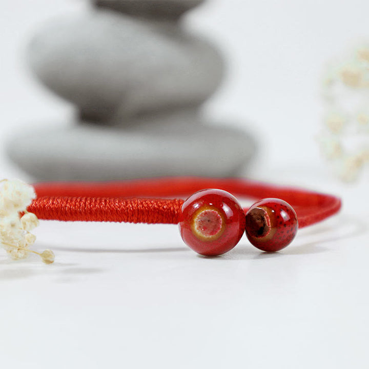 Pulsera de cerámica con hilo rojo de la suerte FengShui de Buddha Stones