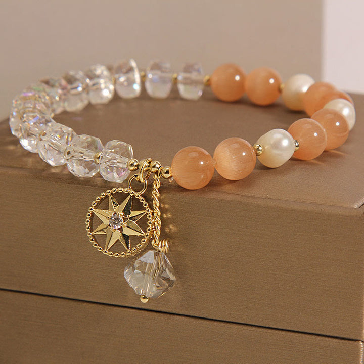 Pulsera de soporte con estrella de cristal blanco y ojo de gato naranja de Buddha Stones