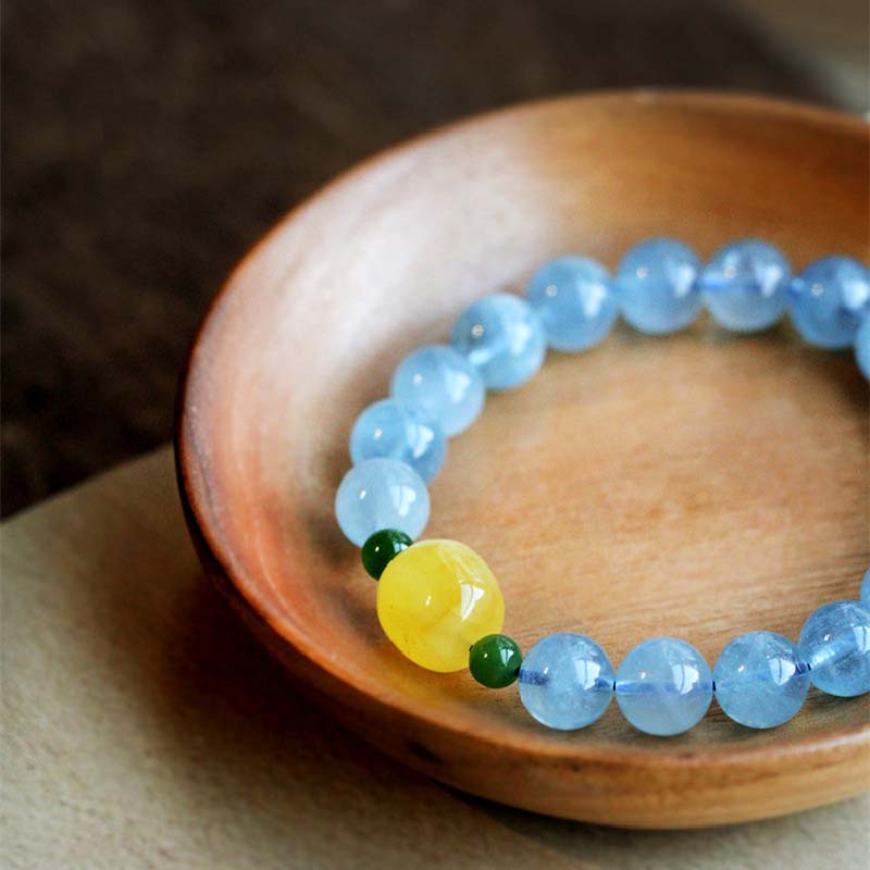 Pulsera curativa de serenidad con cuentas de ámbar y aguamarina natural