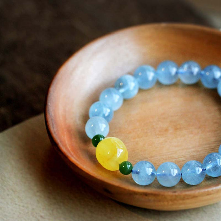 Pulsera curativa de serenidad con cuentas de ámbar y aguamarina natural
