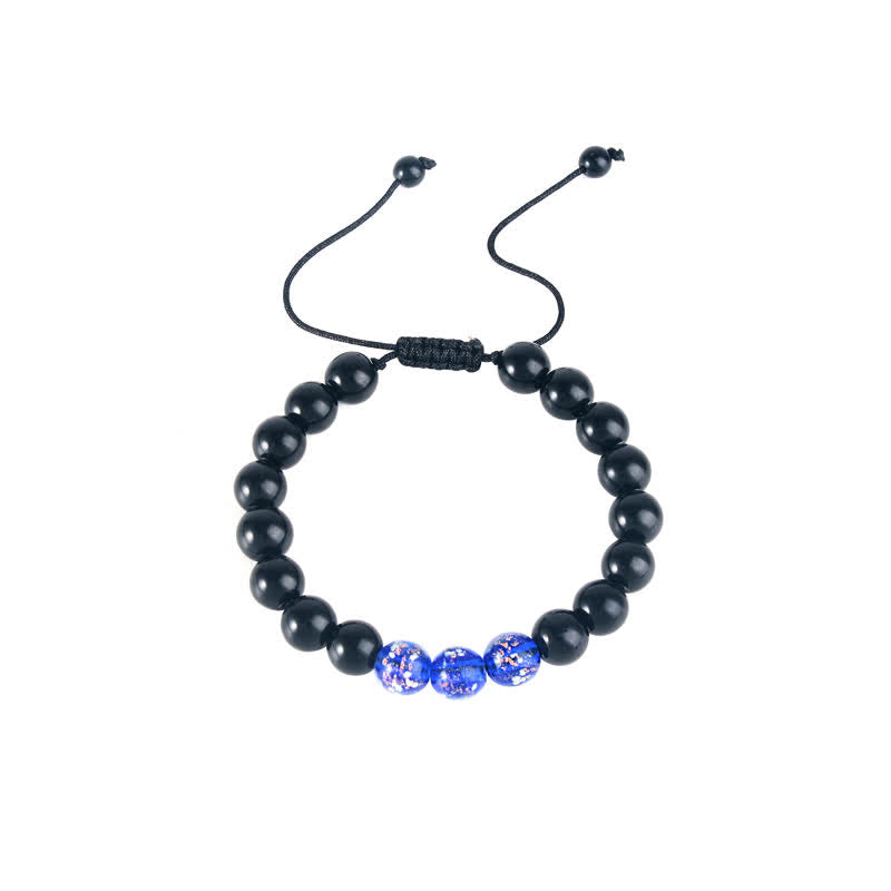 Pulsera de fuerza con piedra luminosa luminosa de obsidiana negra de Buddha Stones