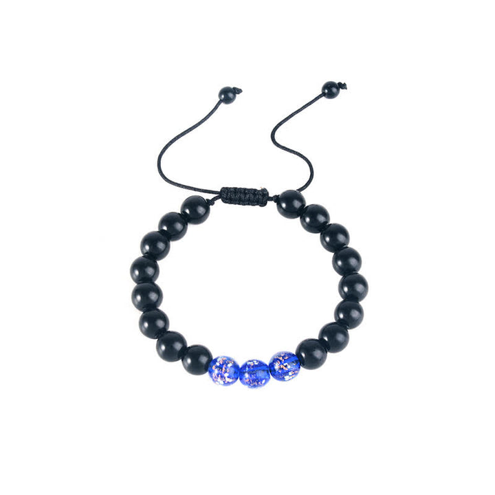 Pulsera de fuerza con piedra luminosa luminosa de obsidiana negra de Buddha Stones