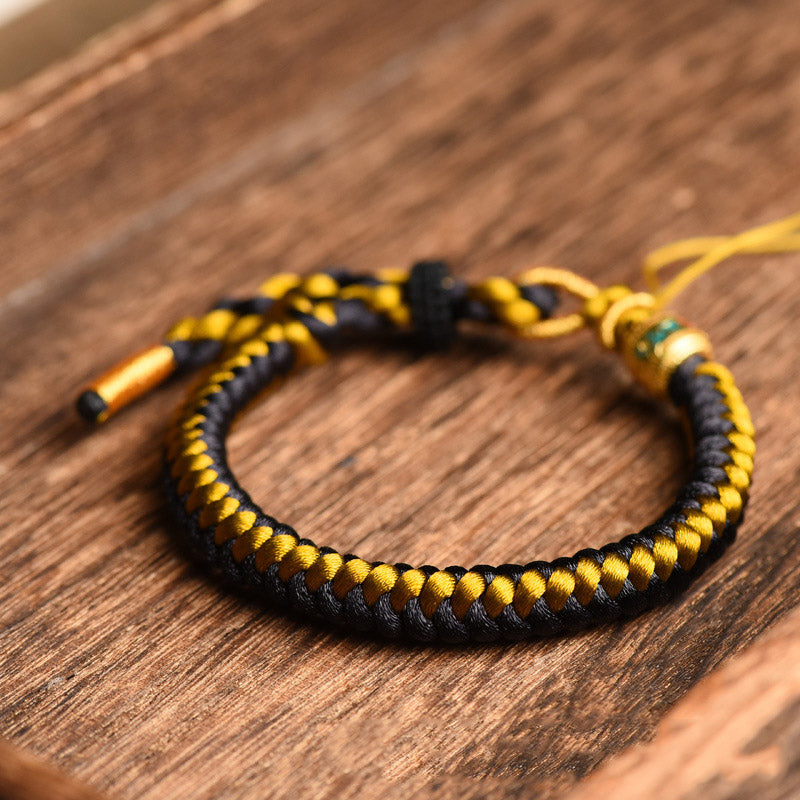 Pulsera de pureza Om Mani Padme Hum de cuerda de dragón de oro negro tibetano hecha a mano con Buddha Stones