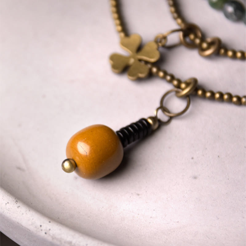 Pulsera multicapa de la suerte de cobre con ágata musgosa y Buddha Stones