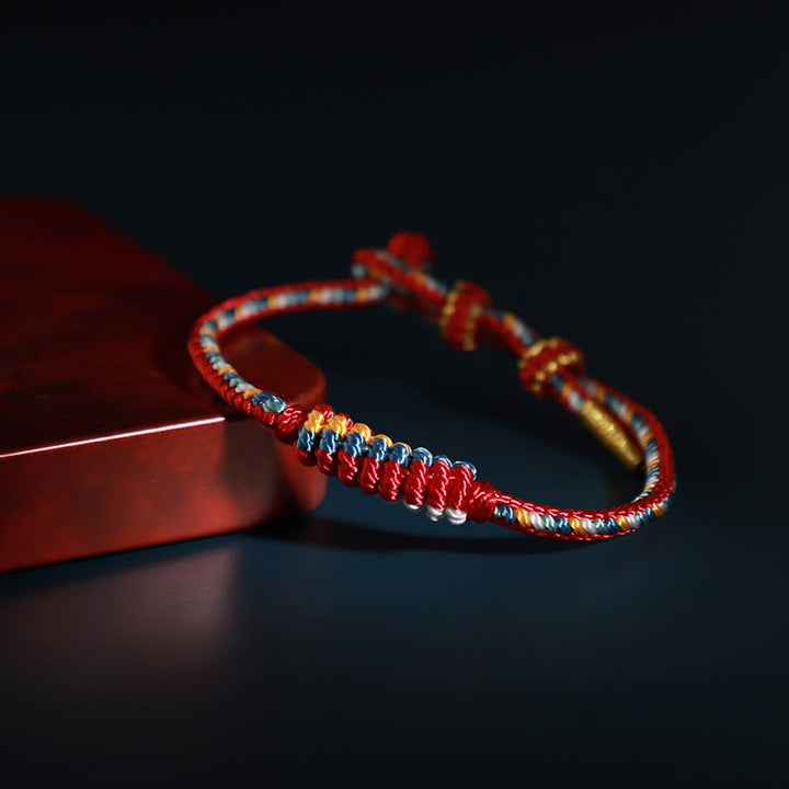 Pulsera de protección trenzada con rueda de oración, nudo de la paz, hecho a mano, con Buddha Stones tibetanas