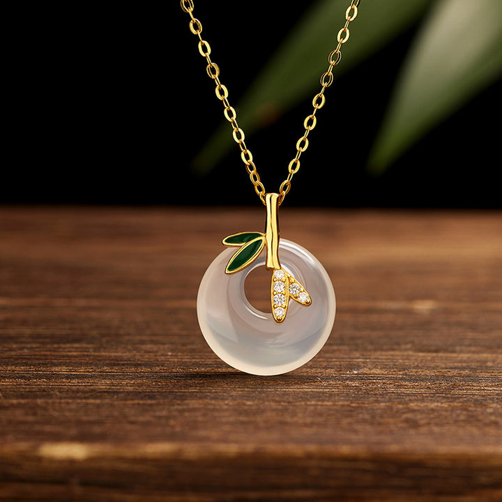 Colgante positivo del collar de la hebilla de la paz de la hoja de bambú de la calcedonia natural de la plata esterlina de las Buddha Stones - Calcedonia de bambú dorado - image 0