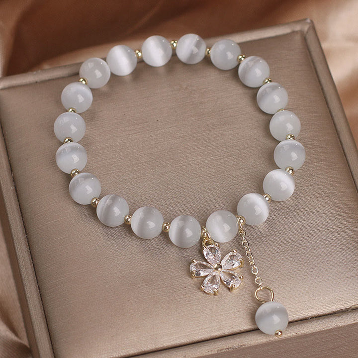 Buddha Stones Pulsera de apoyo a la paz con dije de flor de ojo de gato - image 2