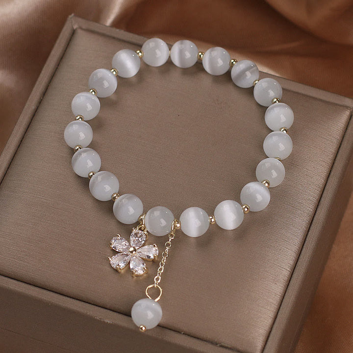 Buddha Stones Pulsera de apoyo a la paz con dije de flor de ojo de gato - image 3