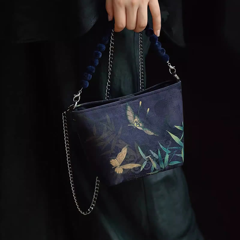 Buddha Stones Bolso bandolera con cadena de metal, diseño de hojas de bambú, mariposas, peonías y urracas. - image 1