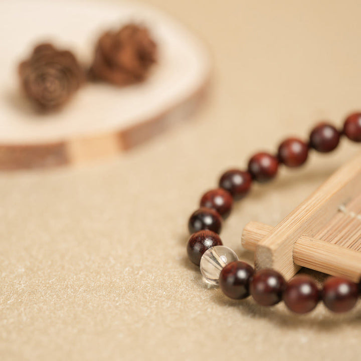 Pulsera de protección de cristal blanco de sándalo rojo hoja pequeña de Buddha Stones