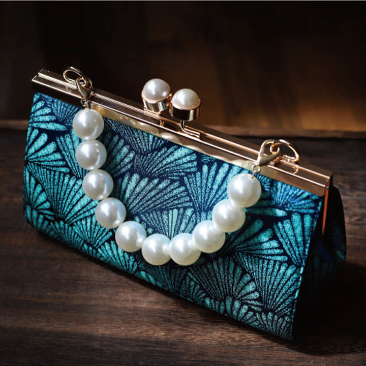 Bolso de mano de metal perlado con diseño de hoja azul pavo real vintage de Buddha Stones