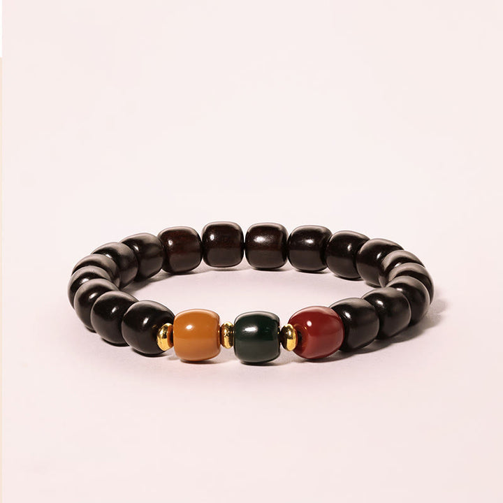 Pulsera de equilibrio de paz de palisandro de madera de ébano con Buddha Stones