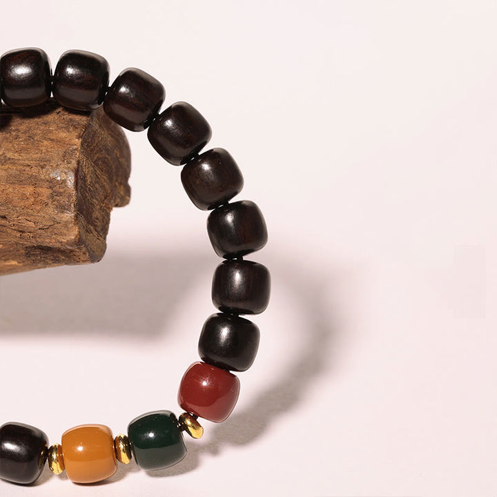Pulsera de equilibrio de paz de palisandro de madera de ébano con Buddha Stones