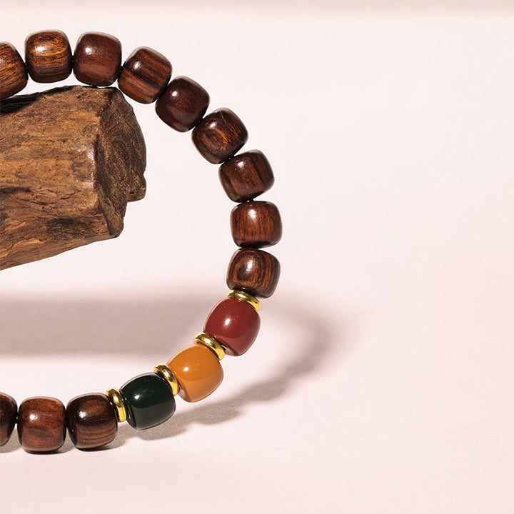 Pulsera de equilibrio de paz de palisandro de madera de ébano con Buddha Stones
