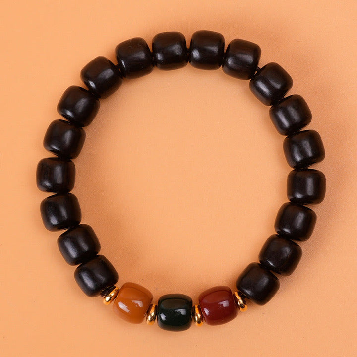 Pulsera de equilibrio de paz de palisandro de madera de ébano con Buddha Stones